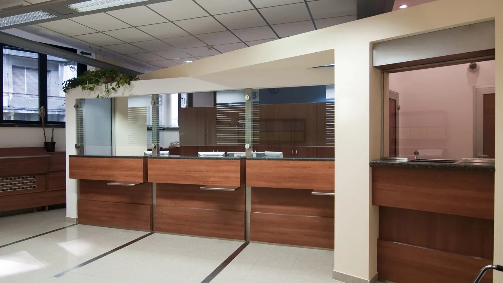 Clean, polished bank branch lobby in Northern Virginia with gleaming floors and tidy customer-facing counters.