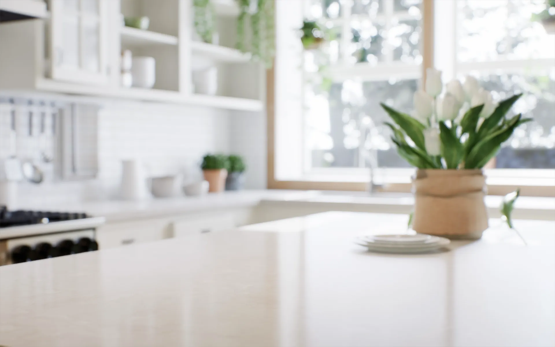 Clean, bright kitchen in a Northern Virginia home with white cabinetry, stone countertops, and natural light.