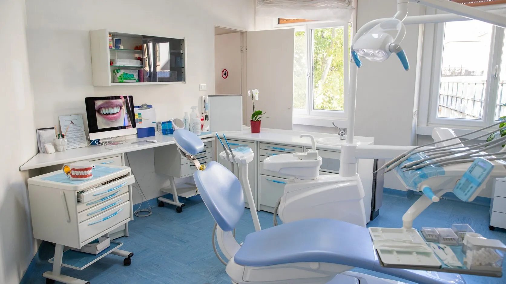 Clean, sanitized dental office operatory and waiting area in Northern Virginia with polished floors and freshly wiped surfaces.
