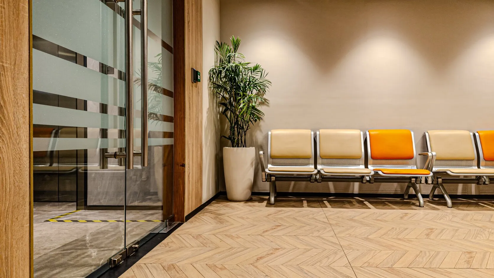 WellNest janitorial crew mopping a clean commercial hallway in a Northern Virginia office building.