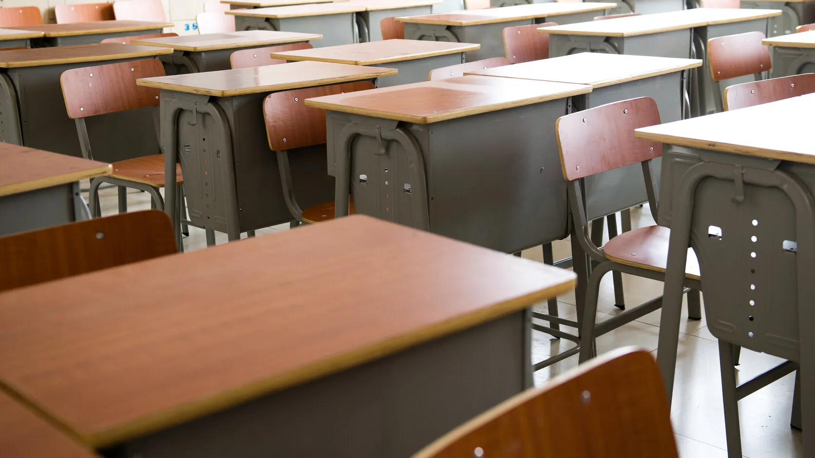 Clean, bright classroom in a Northern Virginia private school with swept floors and tidy desks ready for students.
